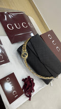 Gucci black embossed leather shoulder bag
